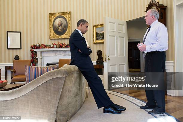 Washington, DC U.S. President Barack Obama reacts as John Brennan briefs him on the details of the shootings at Sandy Hook Elementary School in...