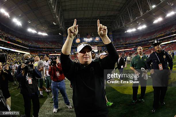 Head coach Chip Kelly of the Oregon Ducks celebrates their 35 to 17 win over the Kansas State Wildcats in the Tostitos Fiesta Bowl at University of...