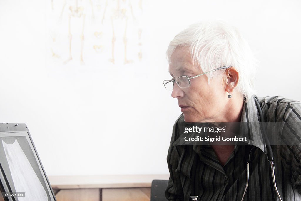 Doctor using computer in office