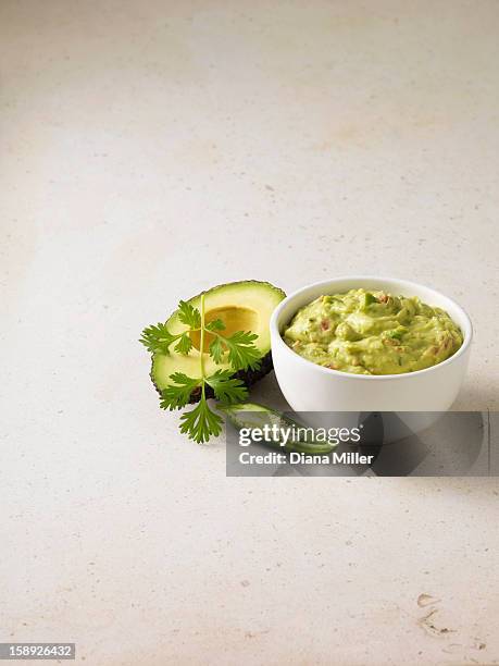 bowl of guacamole with avocado - guacamole stock pictures, royalty-free photos & images