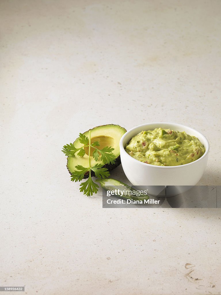 Bowl of guacamole with avocado