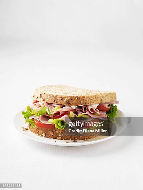 ham and tomato sandwich on plate - sandwich stock-fotos und bilder