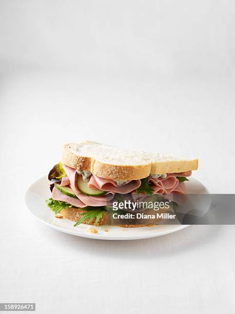ham and cucumber sandwich on plate - sandwich stock-fotos und bilder