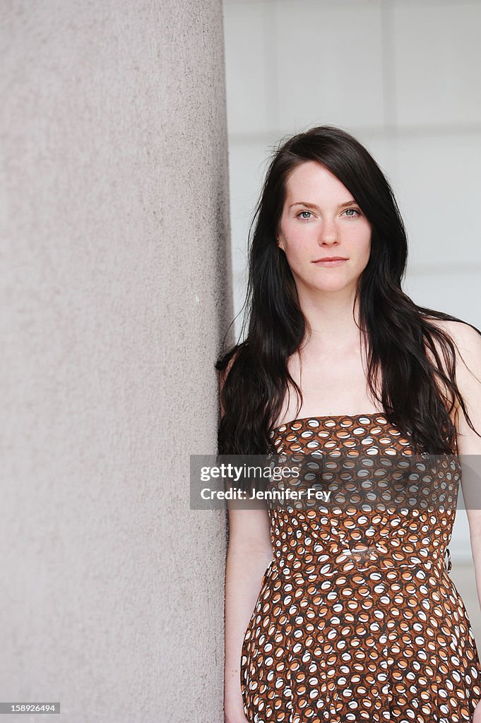 Woman leaning against wall