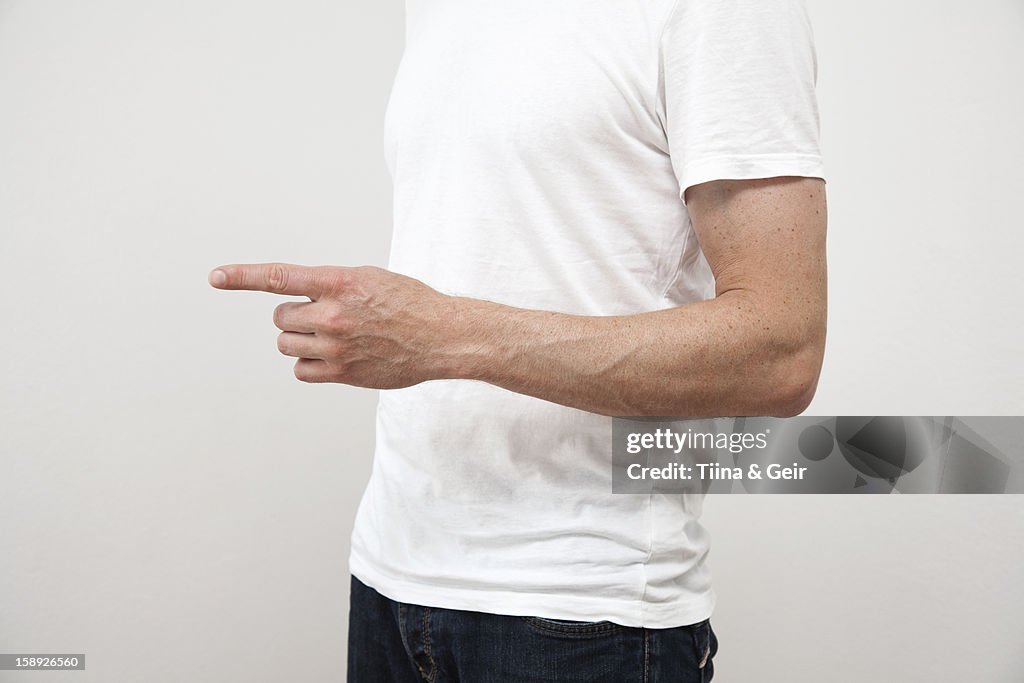 Close up of mans pointing finger