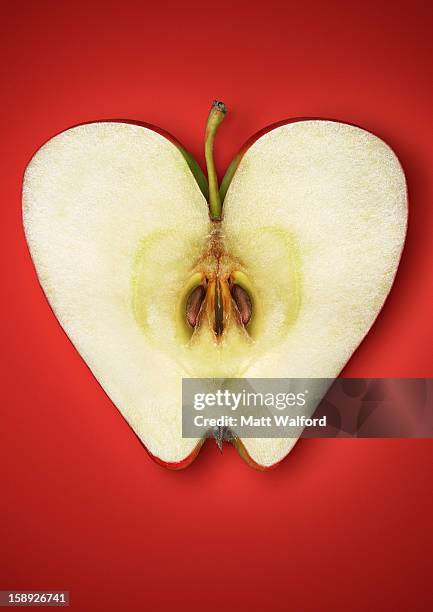 close up of halved apple - apple heart stock pictures, royalty-free photos & images