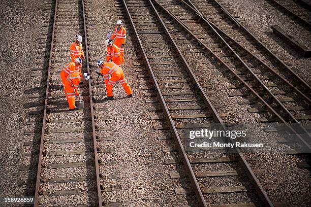railway workers working on railway tracks - railways uk stock-fotos und bilder