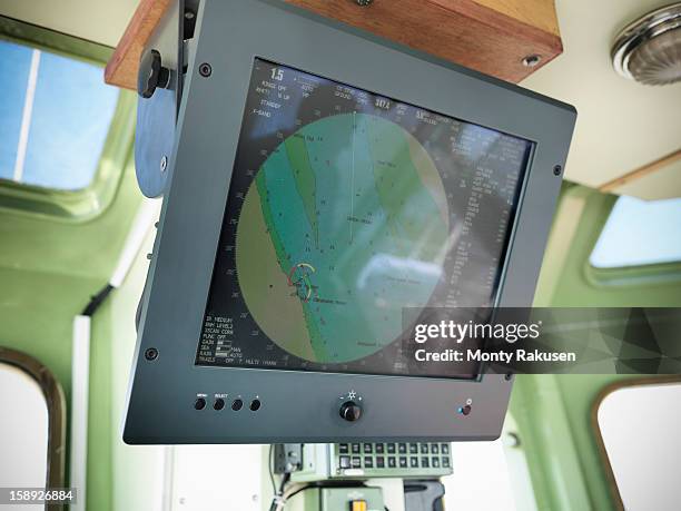 electronic chart on screen in wheelhouse of tugboat - boat gps stockfoto's en -beelden