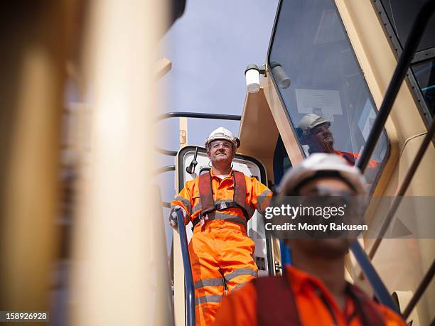tug workers wearing protective clothing on tug - ships bridge 個照片及圖片檔