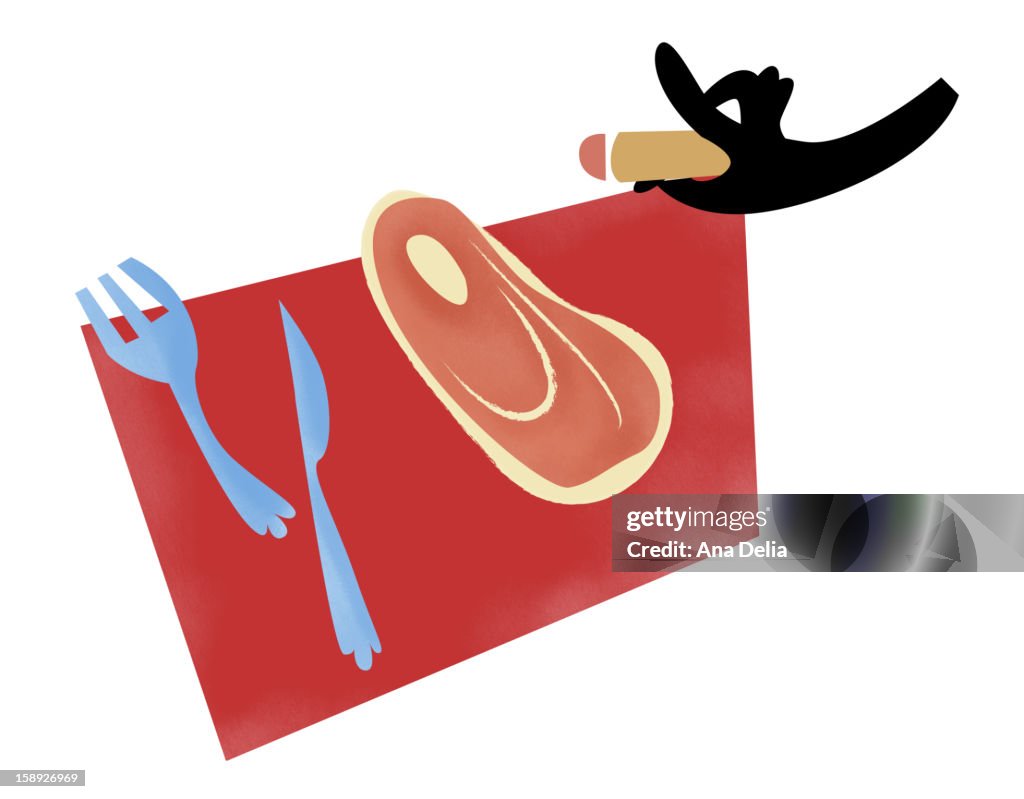 Meat on a placemat with a knife and fork