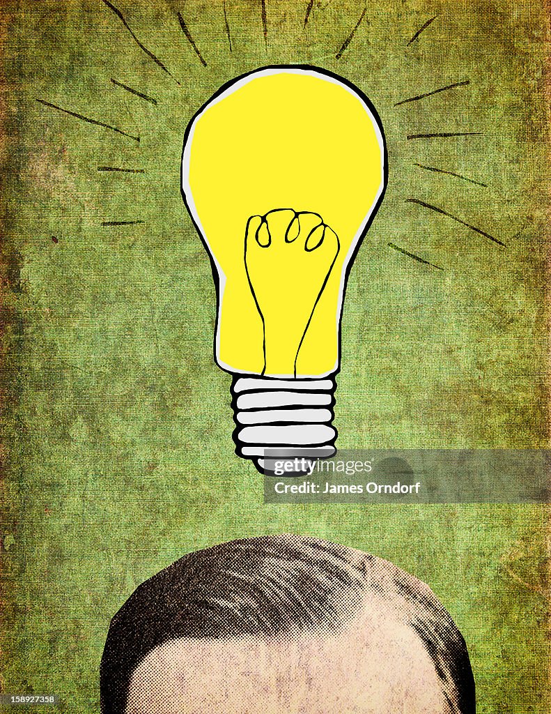 A man with a light bulb over his head