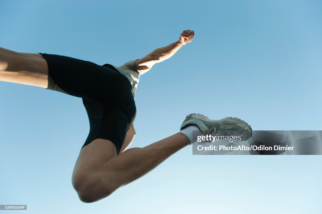 Man jumping in air, directly below