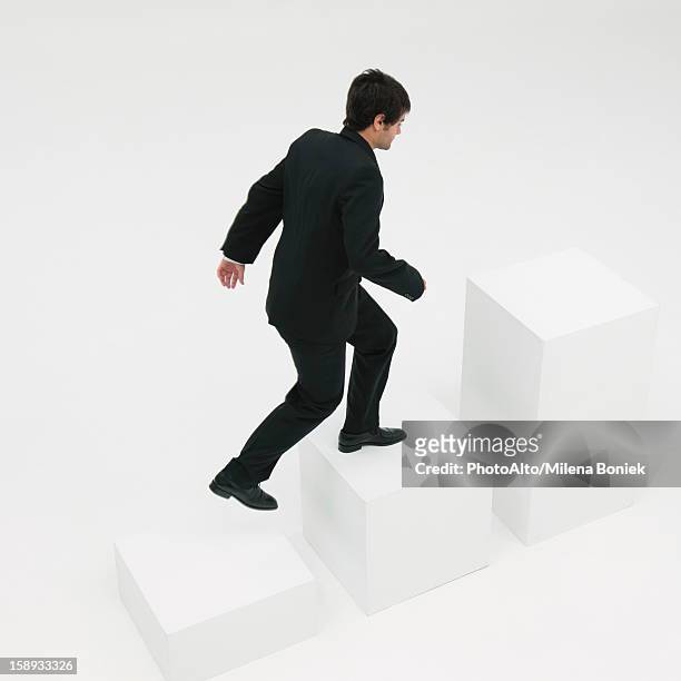 businessman ascending steps - 階段　のぼる ストックフォトと画像