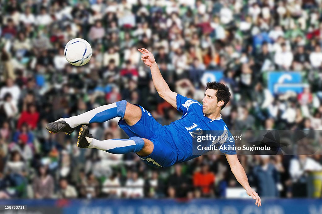 Soccer player performing aerial kick