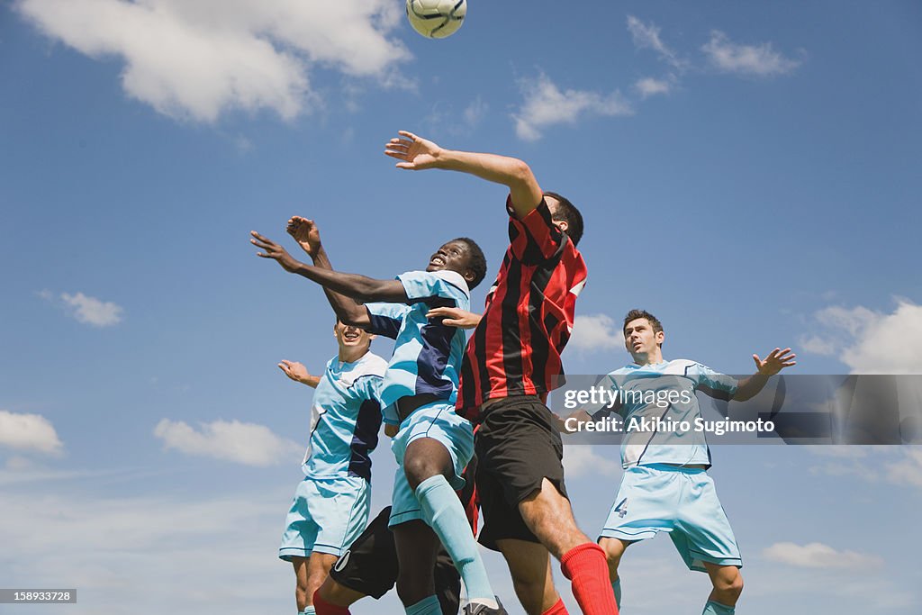 Soccer players jumping for header
