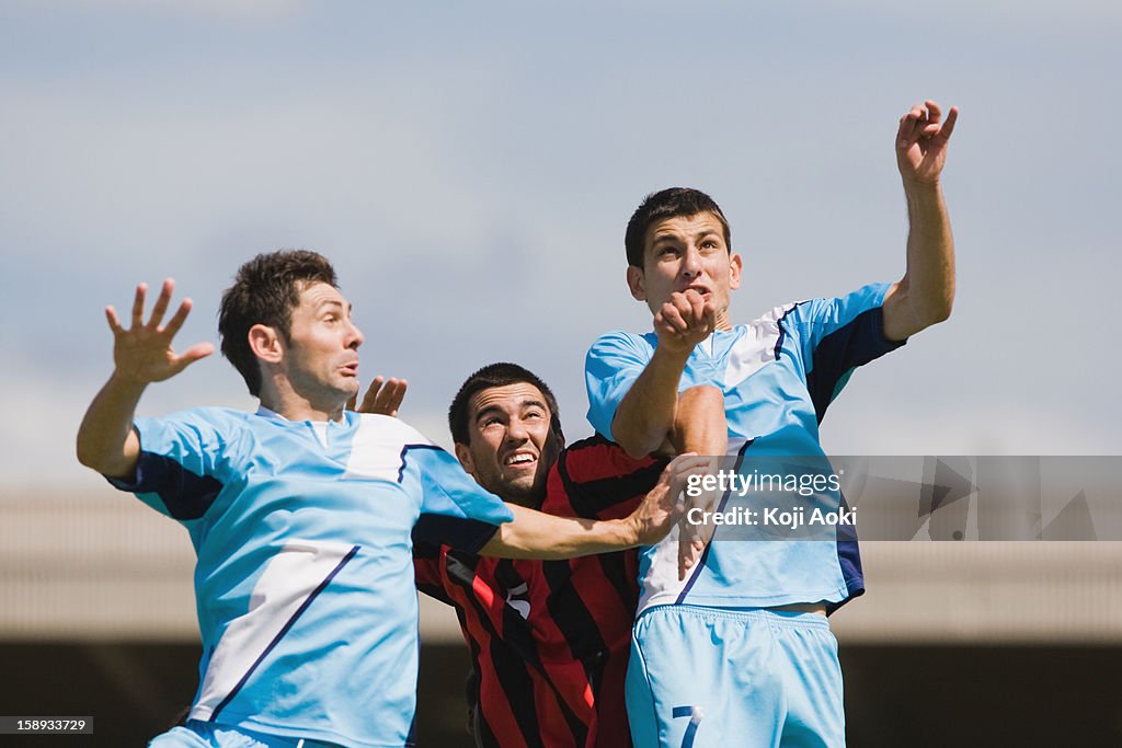 Soccer players jumping for header