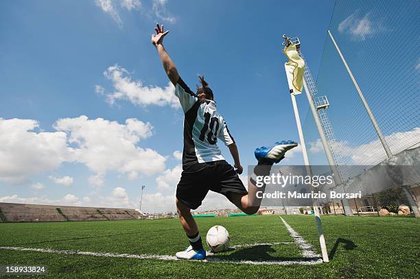 sportswoman kicking soccer ball - corner kick stock-fotos und bilder