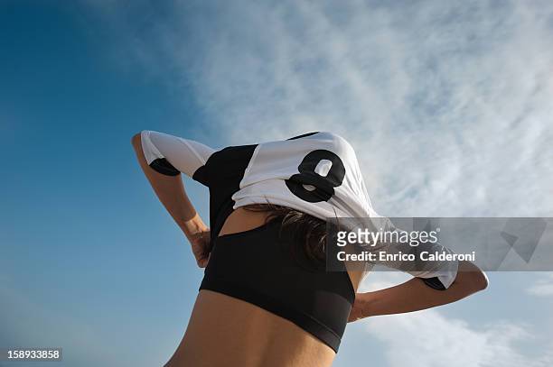 soccer player wearing sports uniform - soccer jerseys stock pictures, royalty-free photos & images