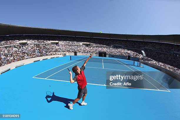 young male tennis player - serving sport stock-fotos und bilder