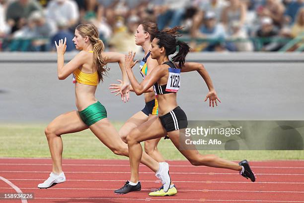 female runners racing - motogp of australia race stockfoto's en -beelden