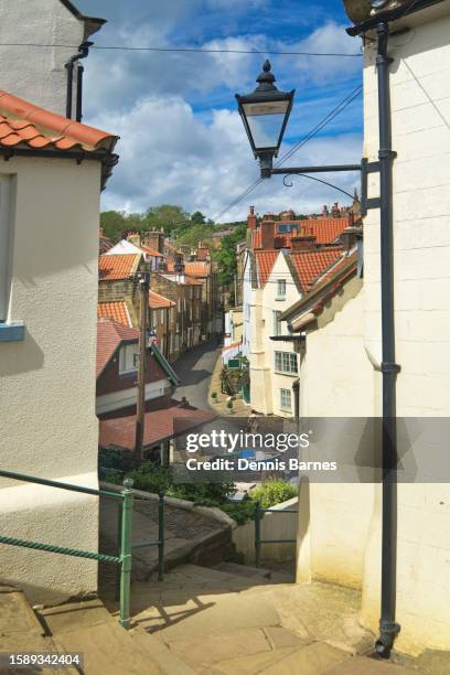 robin hood's bay,  entry to cleveland way path running along seafront.  stairway just off the bay hotel  square which overlooks the beach and sea front, at the bottom of new road. - robin hood's bay imagens e fotografias de stock