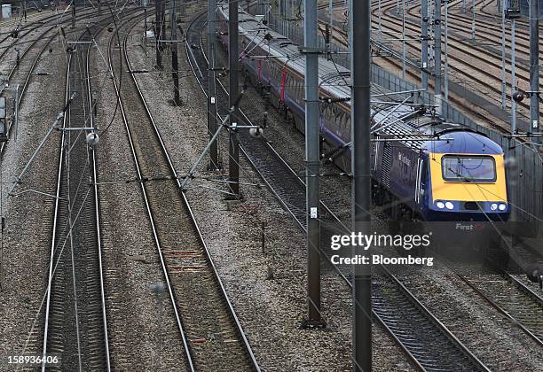 FirstGroup Plc train arrives at Paddington railway station in London, U.K., on Thursday, Jan. 3 2013. Rail commuters have been hit by inflation...