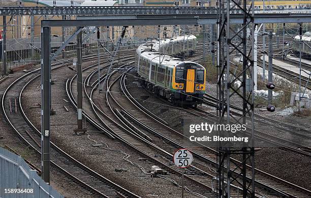 London Midland train is seen arriving at Euston railway station in London, U.K., on Thursday, Jan. 3 2013. Rail commuters have been hit by inflation...