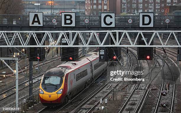 West Coast train, operated by Virgin Trains, is seen leaving Euston railway station in London, U.K., on Thursday, Jan. 3 2013. Rail commuters have...