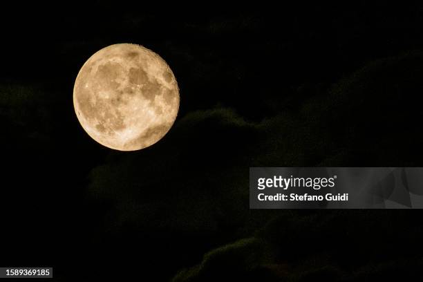 Clouds near the Sturgeon Super Moon seen on August 2, 2023 in Turin, Italy. This is the first of two super moons in the month of August, with the end...