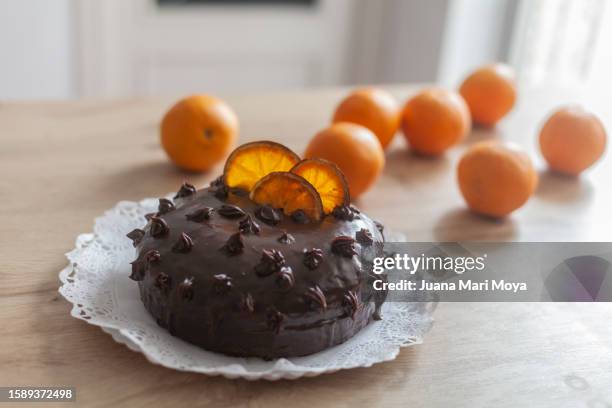 chocolate and orange cake - rufous hornero stock pictures, royalty-free photos & images