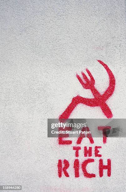 graffitti on a wall - anti globalization stock pictures, royalty-free photos & images