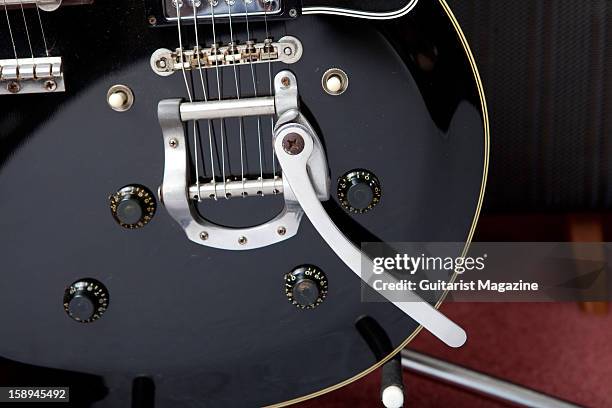 The vibrato bridge of a double-necked Gibson Les Paul electric guitar owned by English progressive rock guitarist Steve Howe, photographed during a...