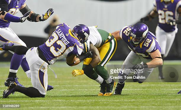 Jamarca Sanford of the Minnesota Vikings makes a tackle during an NFL game against the Green Bay Packers at the Hubert H. Humphrey Metrodome, on...