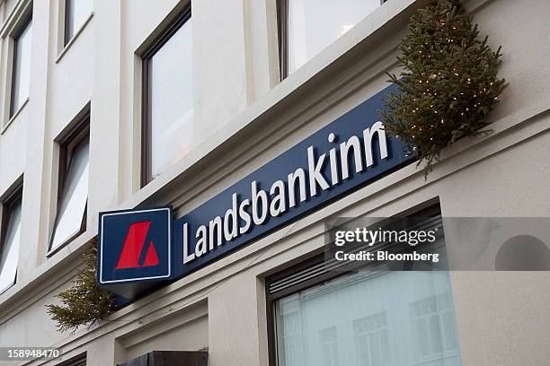 Logo sits on display outside the offices of the Landsbankinn hf bank in Reykjavik, Iceland, on Wednesday, Jan. 2, 2013. Creditors of Iceland's three...