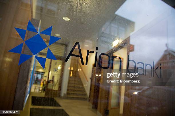 Logo is seen in the window of an Arion Banki hf bank branch in Reykjavik, Iceland, on Wednesday, Jan. 2, 2013. Creditors of Iceland's three biggest...