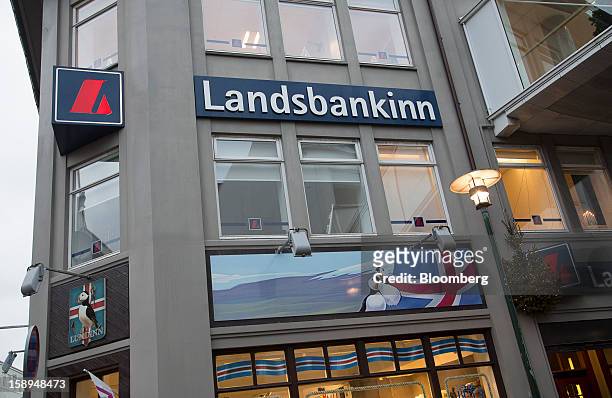 Logo sits on display outside the offices of the Landsbankinn hf bank in Reykjavik, Iceland, on Wednesday, Jan. 2, 2013. Creditors of Iceland's three...