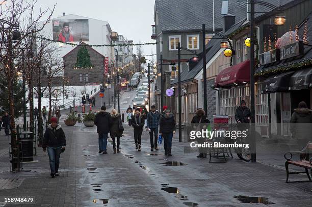 Pedestrians walk along a shopping street in Reykjavik, Iceland, on Wednesday, Jan. 2, 2013. Creditors of Iceland's three biggest failed banks are...