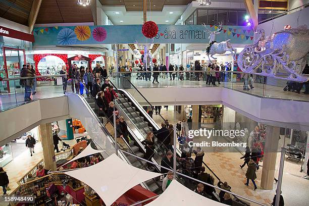 Customers shop inside the Kringlan shopping center in Reykjavik, Iceland, on Wednesday, Jan. 2, 2013. Creditors of Iceland's three biggest failed...