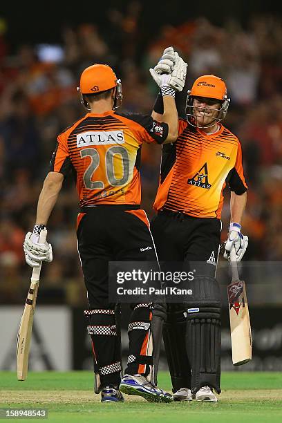 Shaun Marsh and Marcus North of the Scorchers celebrate winning the Big Bash League match between the Perth Scorchers and the Sydney Thunder at WACA...