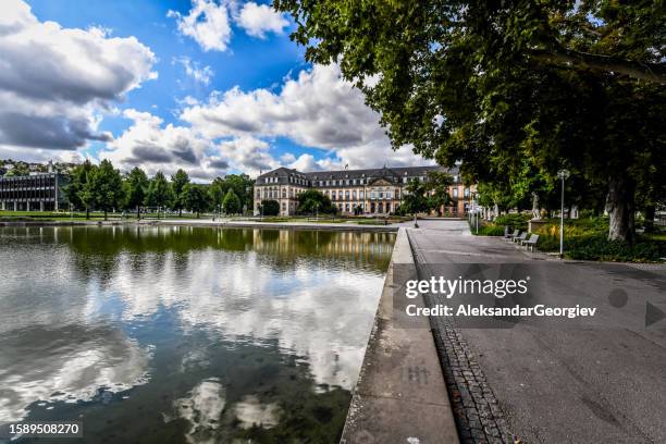 park and pond quayside leading to ministry of finance of baden-wuerttemberg in stuttgart, germany - tübingen stock pictures, royalty-free photos & images