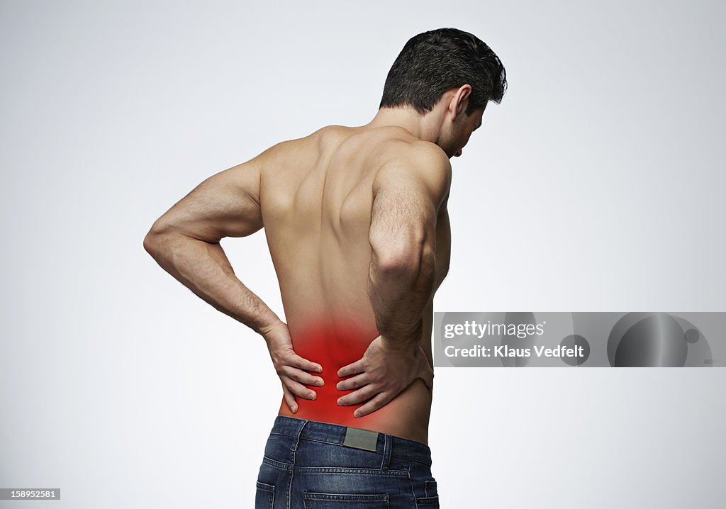 Man having lower back pain (rear view)