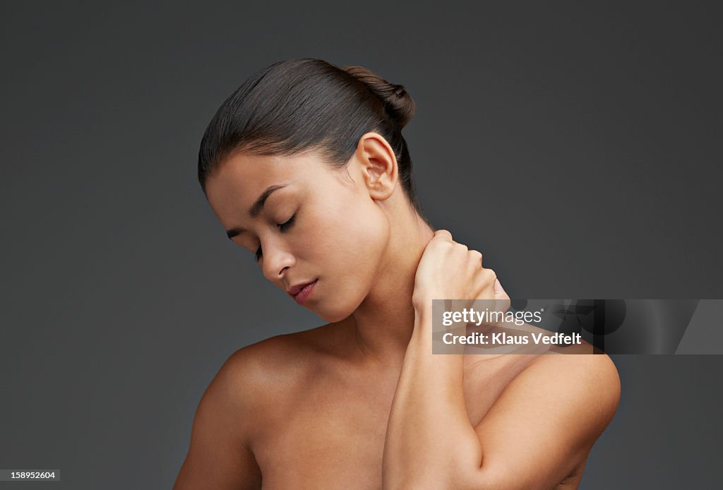 Close-up of woman having neck pain