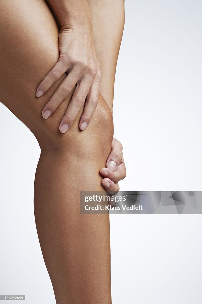 Close up of woman having knee pain