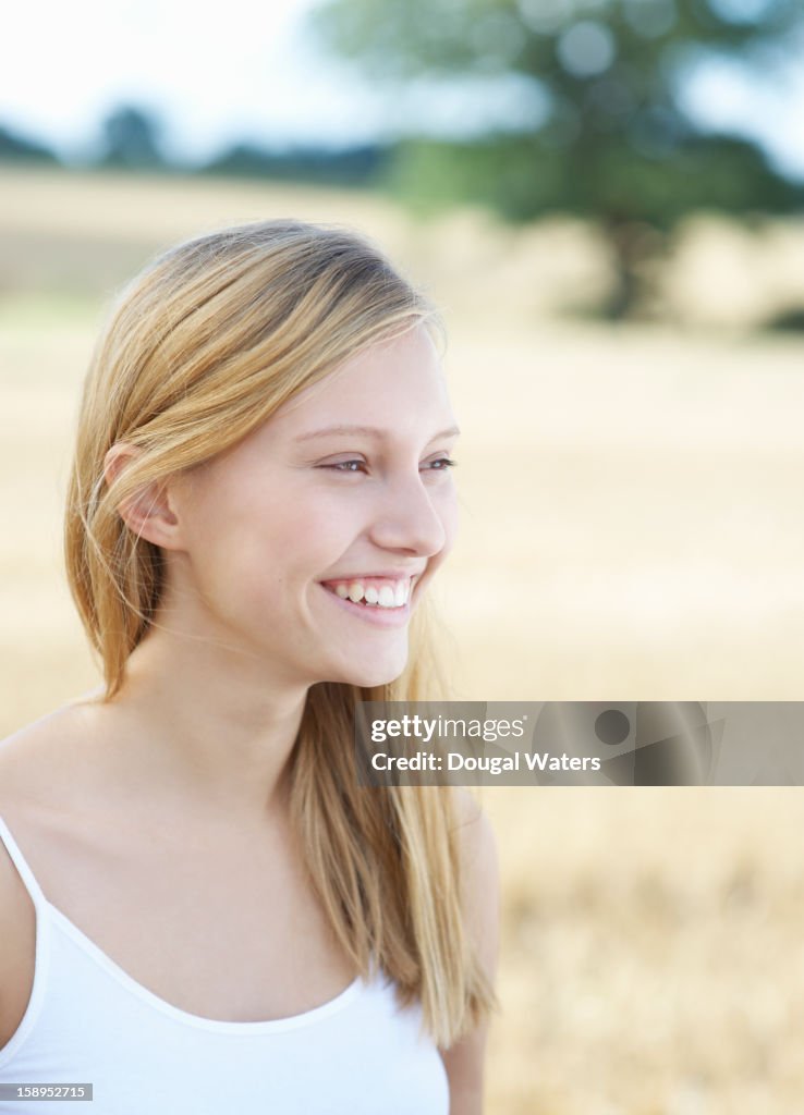 Beautiful woman smiling in countryside.