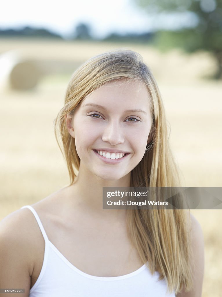 Portrait of beautiful woman in countryside.