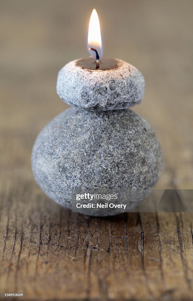 Candle on stone