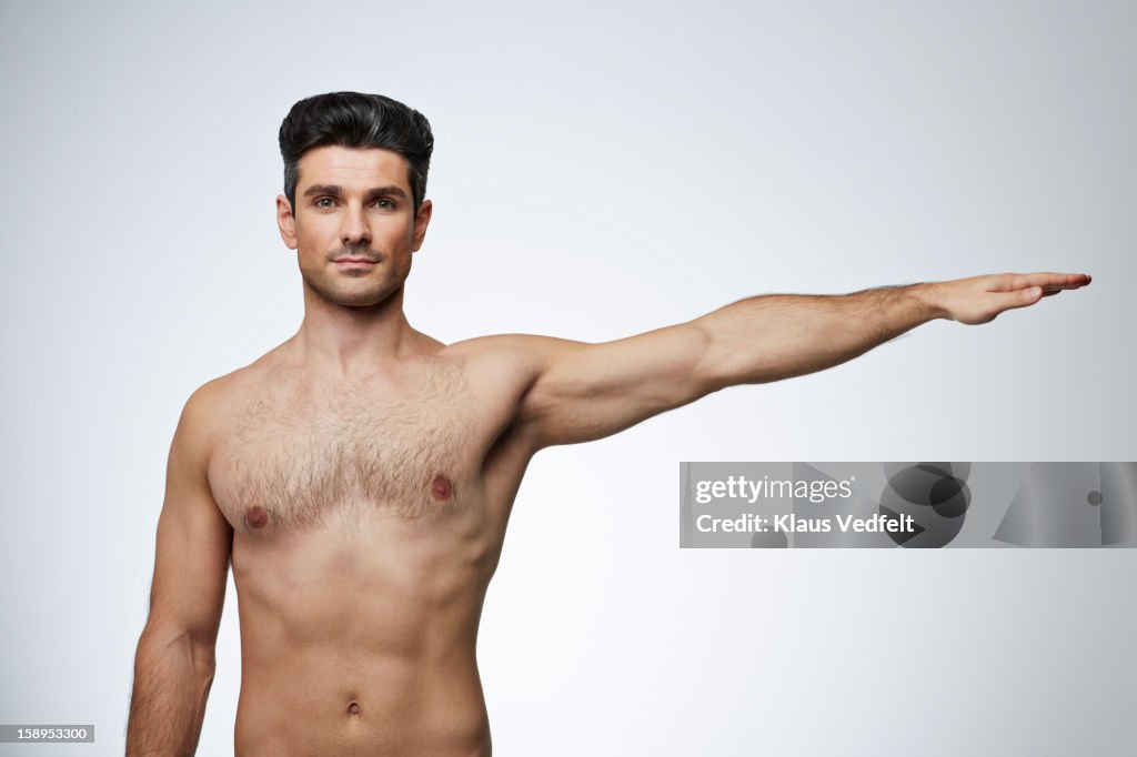 Man Extending Arm Man Stretching Arm Out To The Side Stock-Foto - Getty Images