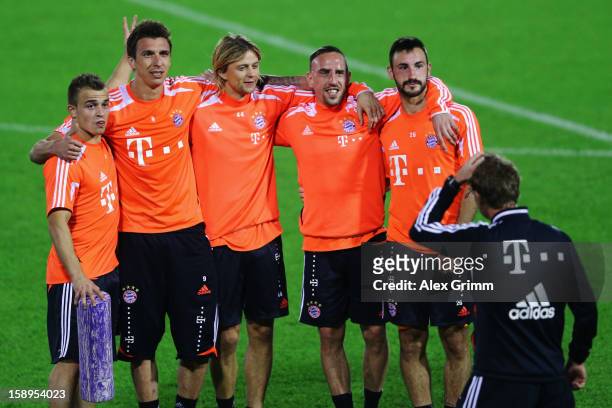M11, Mario Mandzukic, Anatoliy Tymoshchuk, Franck Ribery and Diego Contento pose during a Bayern Muenchen training session at the ASPIRE Academy for...