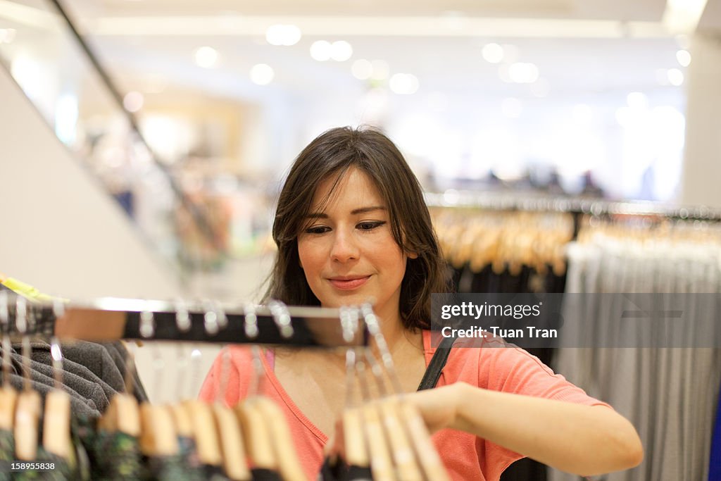 Woman looking for clothes at the mall