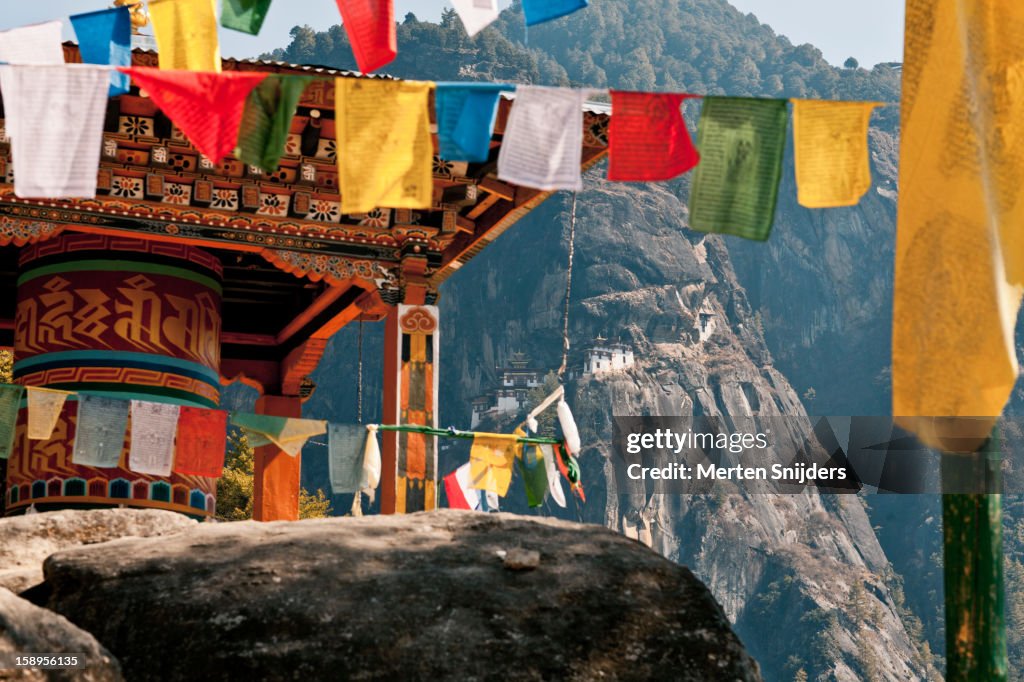 Taktshang Monastery behind prayer wheel